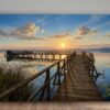 Leinwandbild Sonnenuntergang am See mit Holzsteg, Schwan in ruhiger Natur